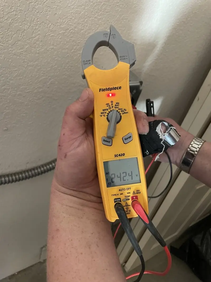Voltage testing with clamp meter during Aluminum Wiring Replacement in Montcalm